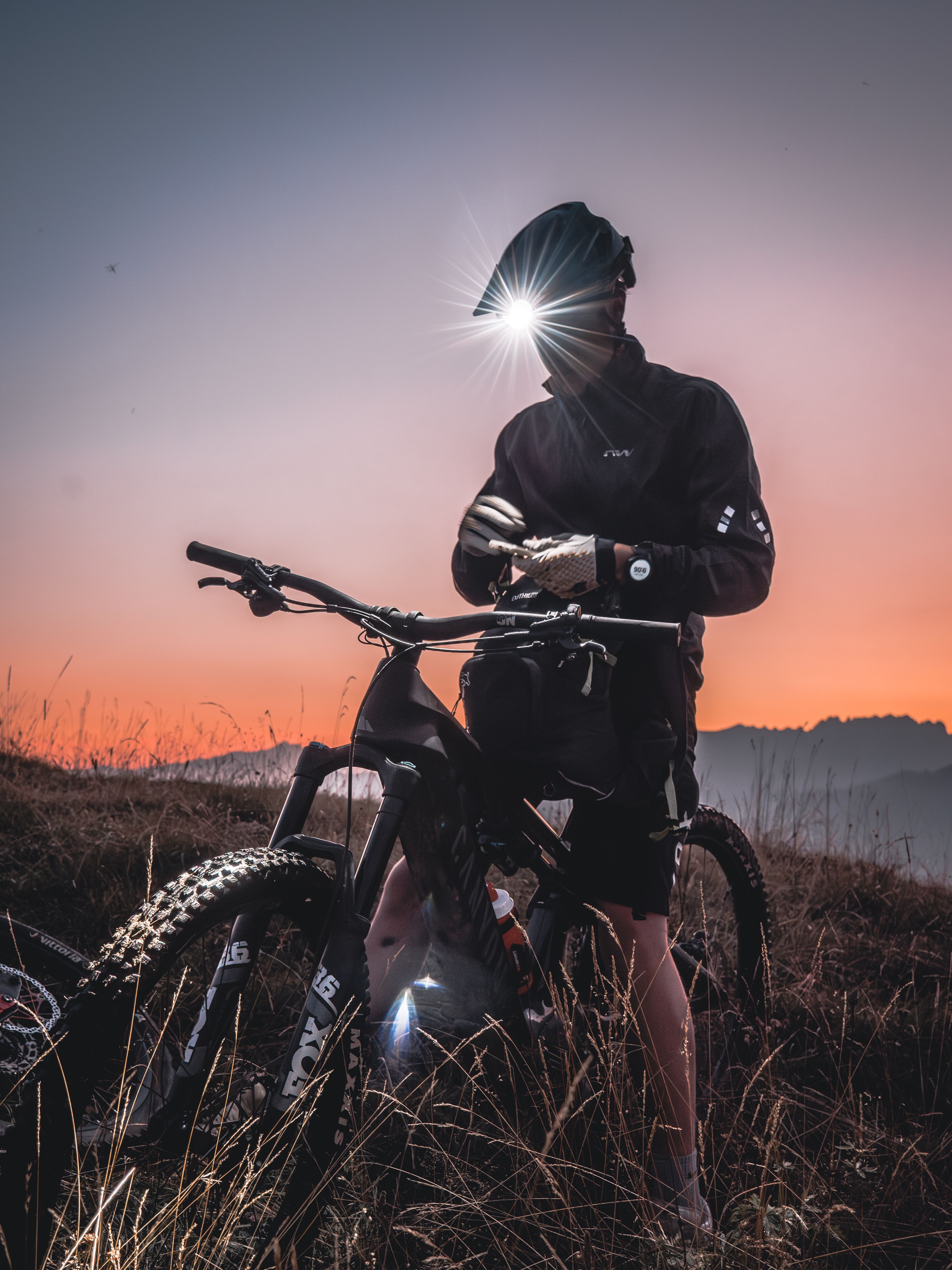 A rider pausing before a historic Venetian palazzo at golden hour.